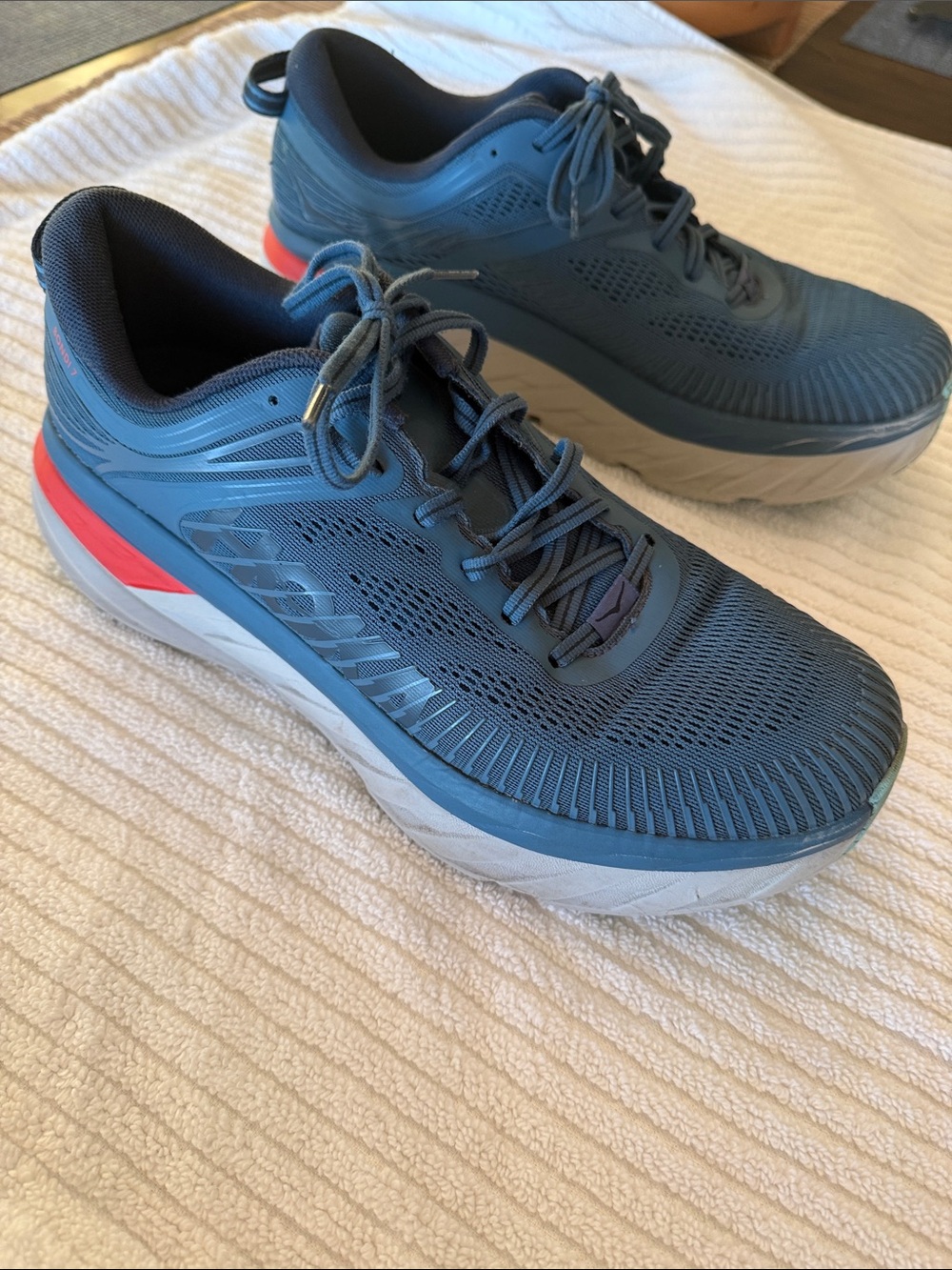 Hoka Bondi 7 Men's Running Shoes in Blue with Orange Accent